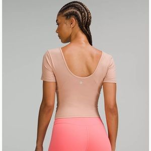 Pretty much the lululemon Aline top with no padding and longer sleeves!